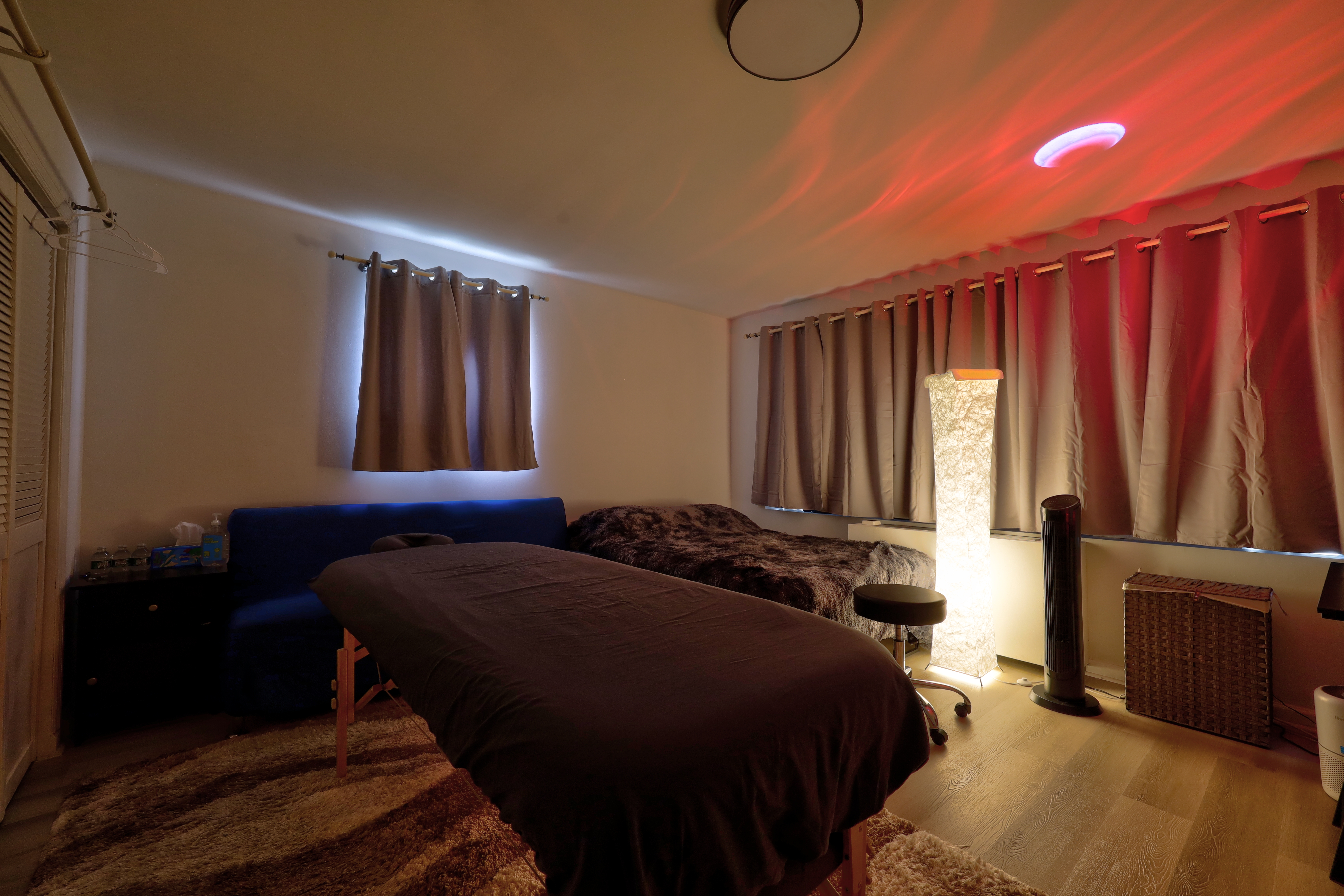 Private tantric massage studio Chelsea Manhattan near Penn Station warm atmospheric lighting